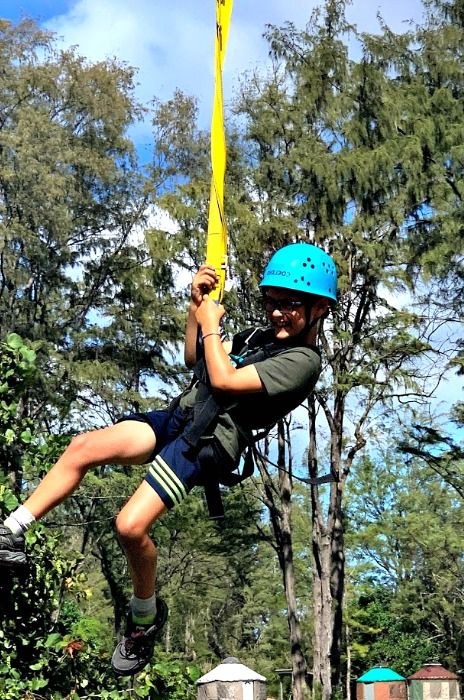 Boy enjoying the zip line activity at Aloha Beach Camp's 2021 Hawaii summer camp program