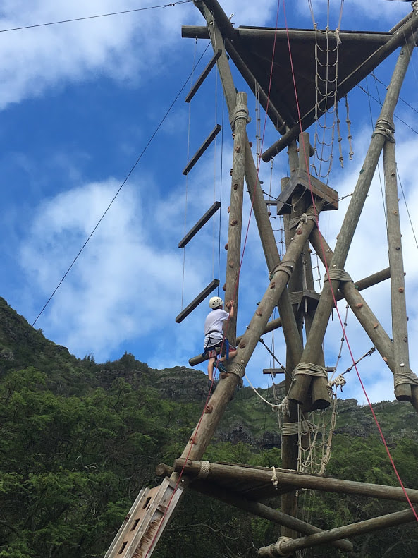 Boy climbs the Alpine Tower at Aloha Beach Camp's Hawaii Summer Camp