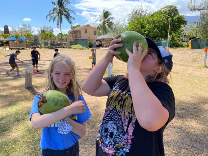 Campers enjoying the coconut tasting activity at Aloha Beach Camp Hawaii summer camp