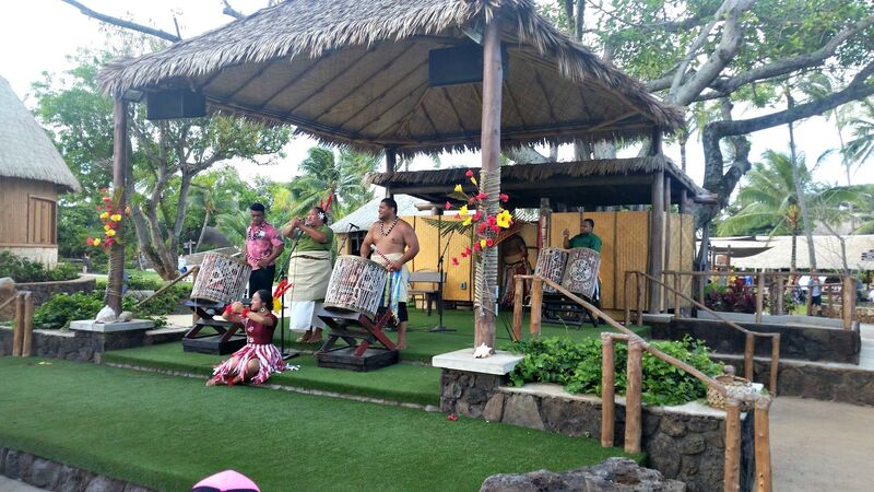 Polynesian Cultural Center entertainers beat the drums and put on a show as campers at Aloha Beach Camp enjoy the show in Oahu, Hawaii.